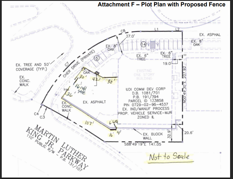 Plot plan of Relentless Collision at 442 Martin Luther King Jr. Parkway showing the proposed 8-foot security fence alignment along Cher Drive and parking area.