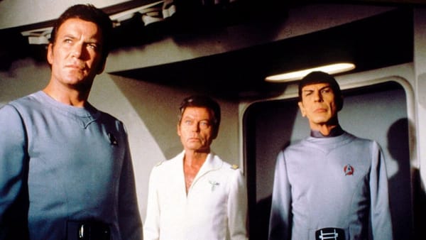 Kirk, McCoy, and Spock aboard the USS Enterprise.