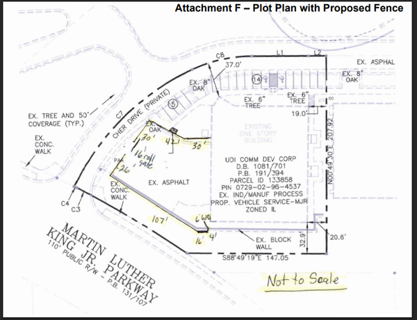 Plot plan of Relentless Collision at 442 Martin Luther King Jr. Parkway showing the proposed 8-foot security fence alignment along Cher Drive and parking area.